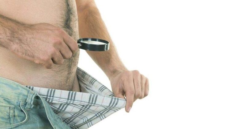 a man looks in his underwear and thinks about penis enlargement with soda